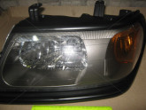 Фара права передня Mitsubishi Pajero Sport 2000-2008 чорн. рант